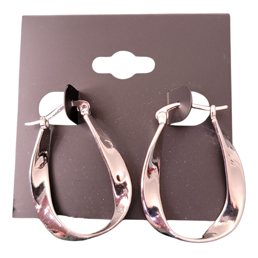 Silver-colored mobius twisted hoop earrings.